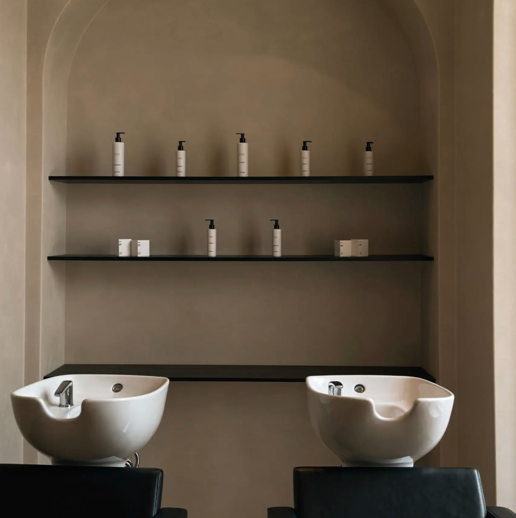 minimalist salon interior with arched alcoves